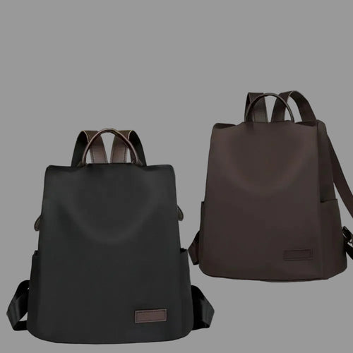 Two black backpacks on a white surface with text describing their features.