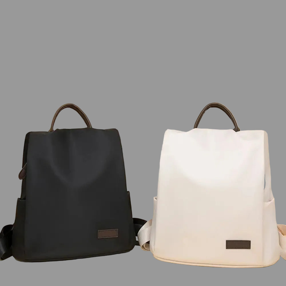 Black and white backpacks on a beige background with text highlighting features.