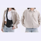 Person wearing a beige shirt with suspenders and a plain background