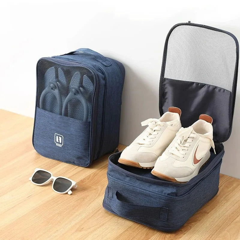 Blue shoe organizer with white sneakers inside, sunglasses on a wooden surface.