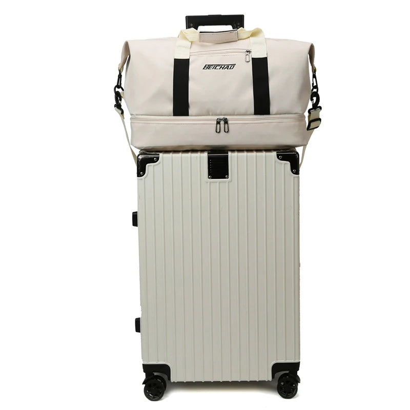 Beige suitcase with a matching duffel bag on a white background