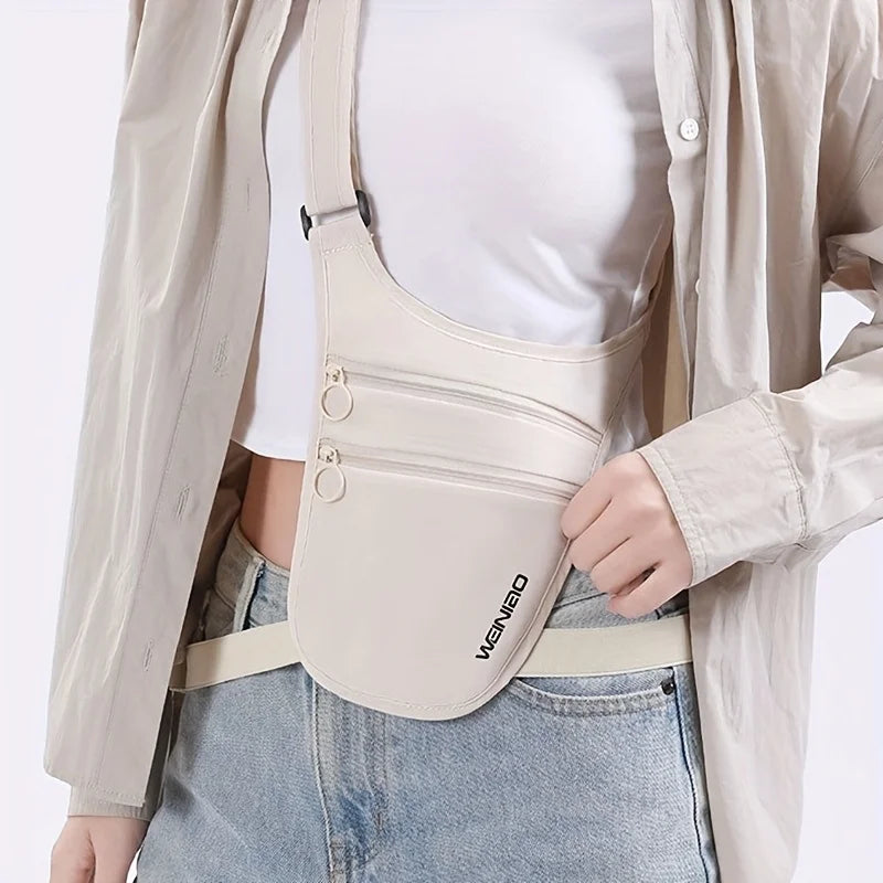 Person wearing a beige waist bag with a visible brand logo on a plain background